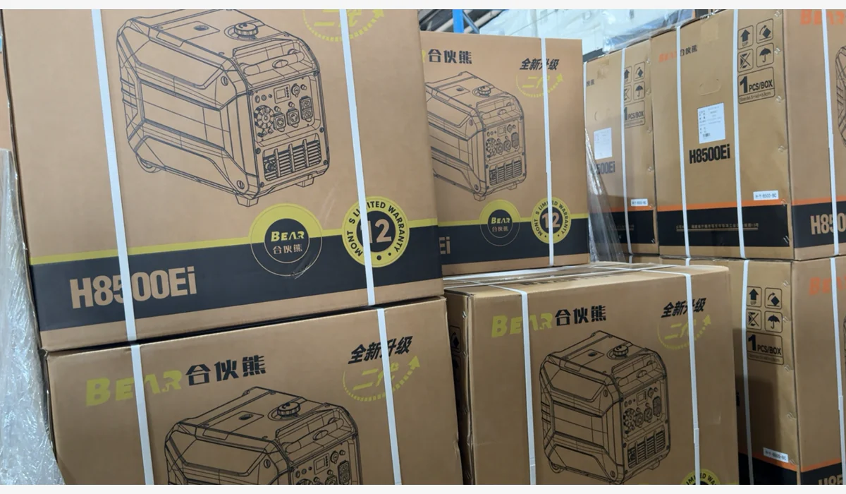 Stacked generator cartons with model, handling, brand and warranty artwork visible