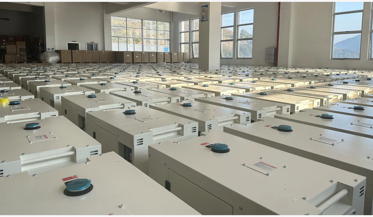 Rows of similarly sized enclosed generator cabinets arranged in a storage area