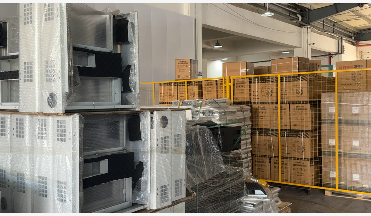 Wrapped generator enclosures and stacked cartons in a separated storage area