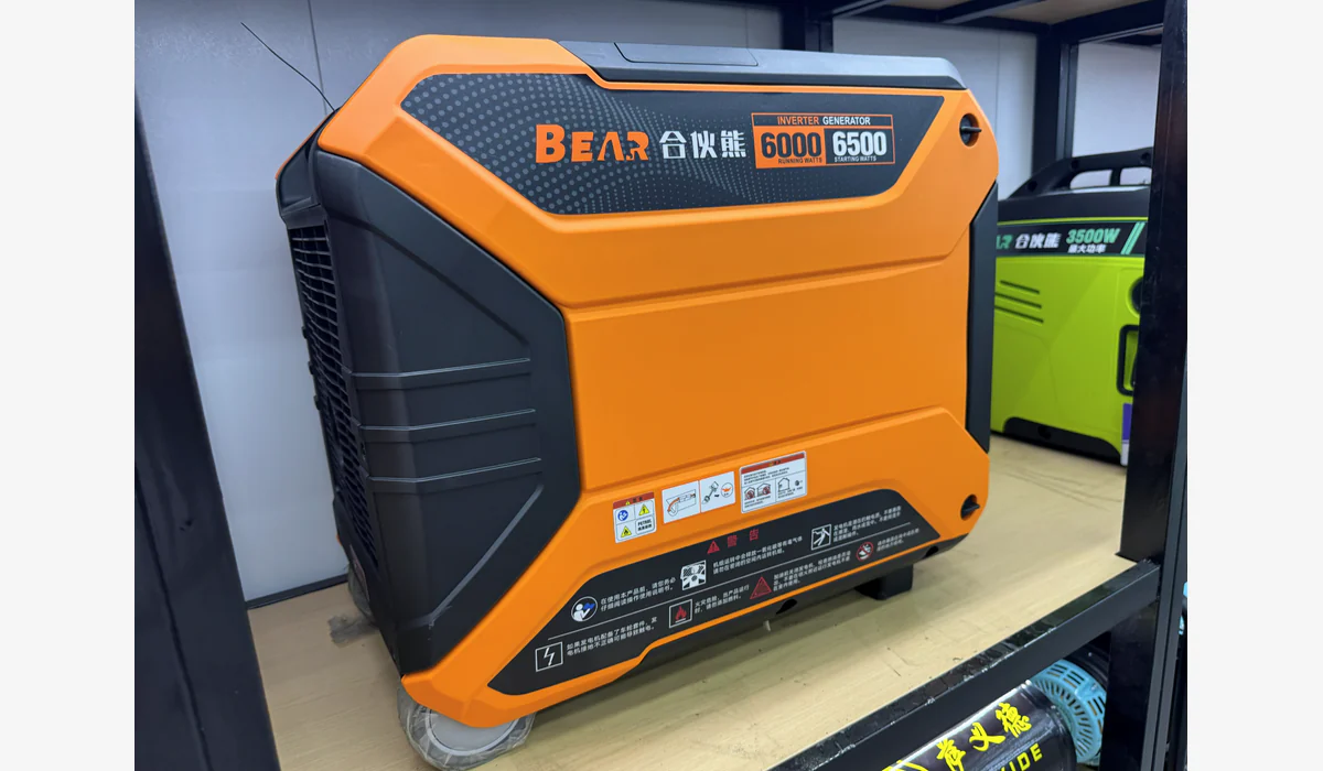 Orange enclosed generator with a visible label reading 6000 running watts and 6500 starting watts