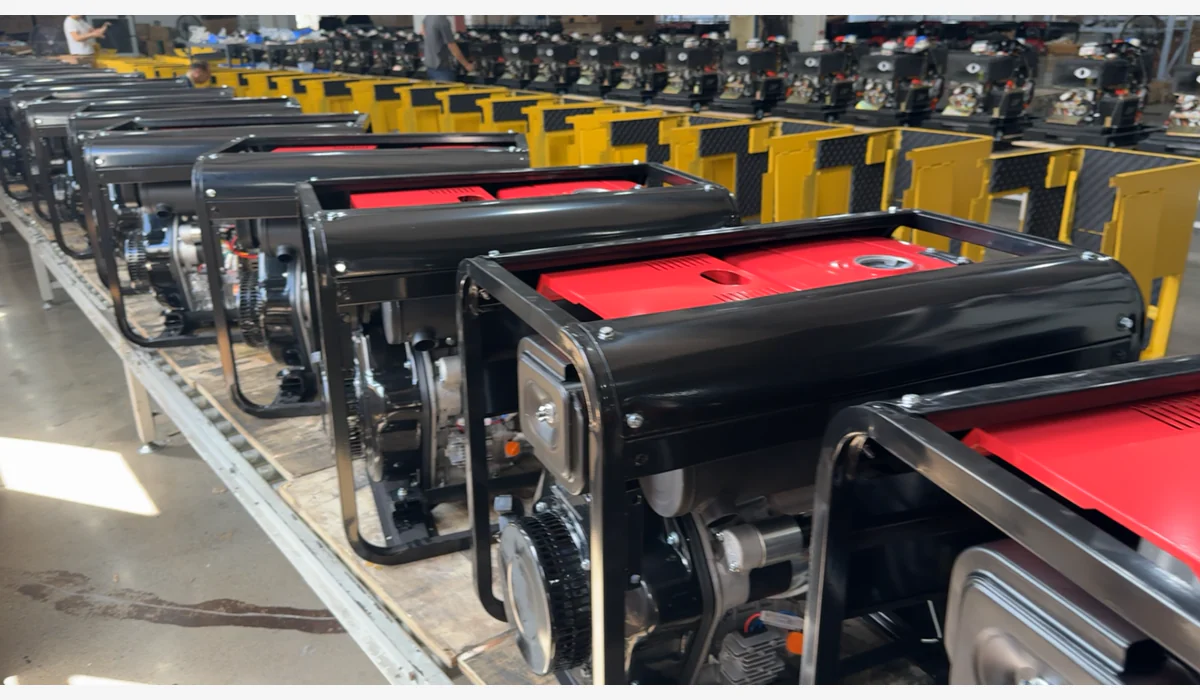 Rows of open-frame generator assemblies and enclosure panels arranged in a workshop