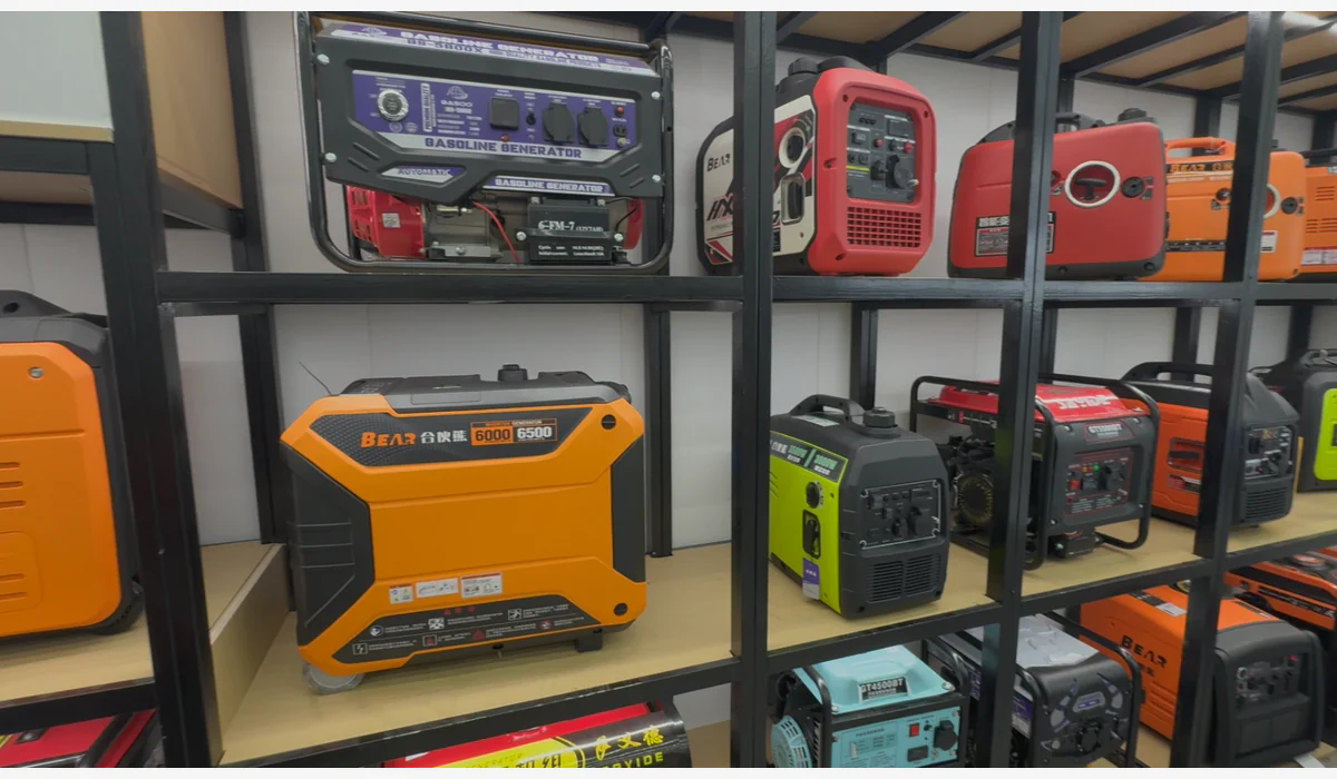 Mixed open-frame and enclosed portable generators displayed on showroom shelving
