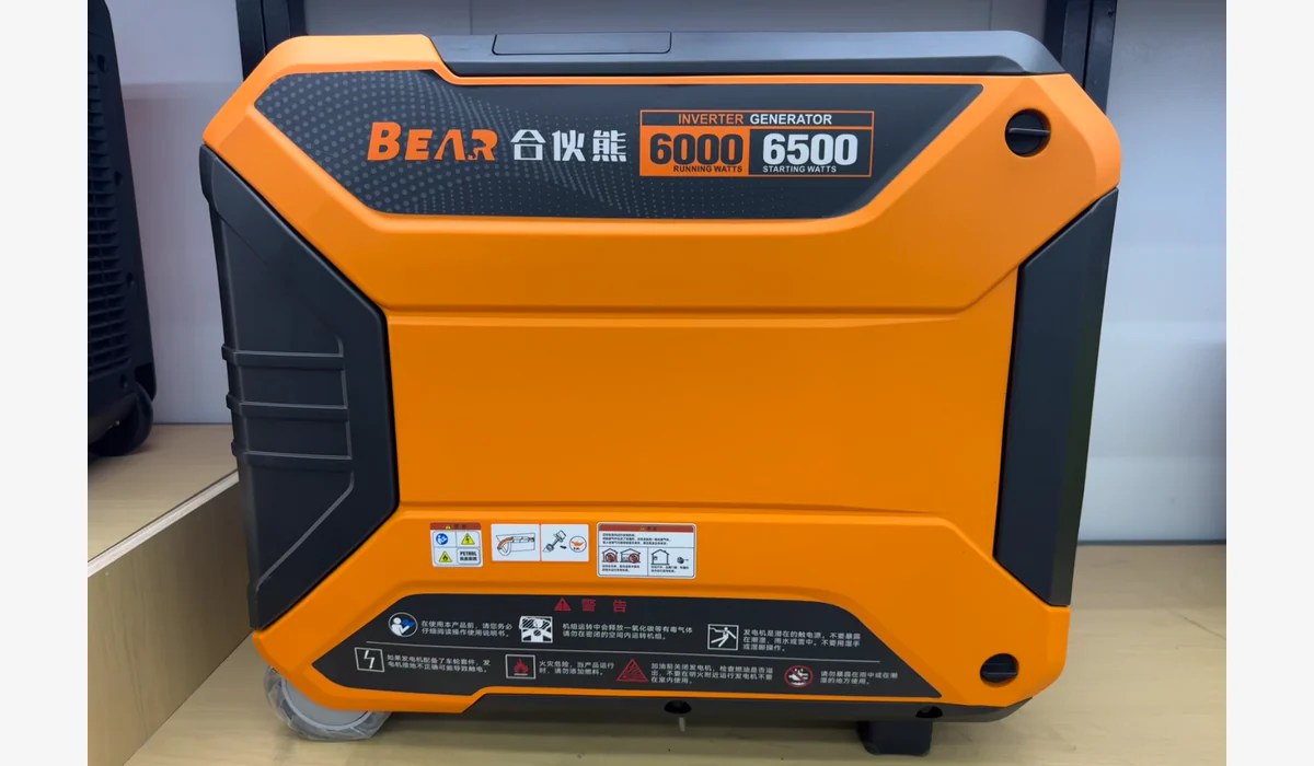 Portable enclosed generator with a visible label reading 6000 running watts and 6500 starting watts