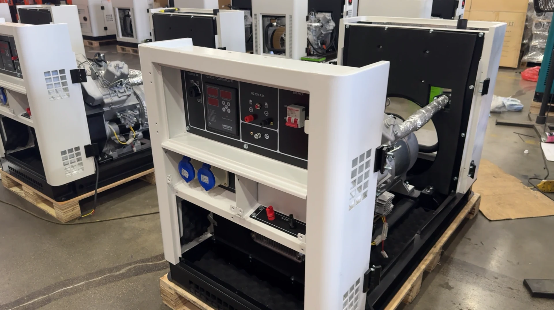 Open generator set on a pallet in a warehouse, visual context only