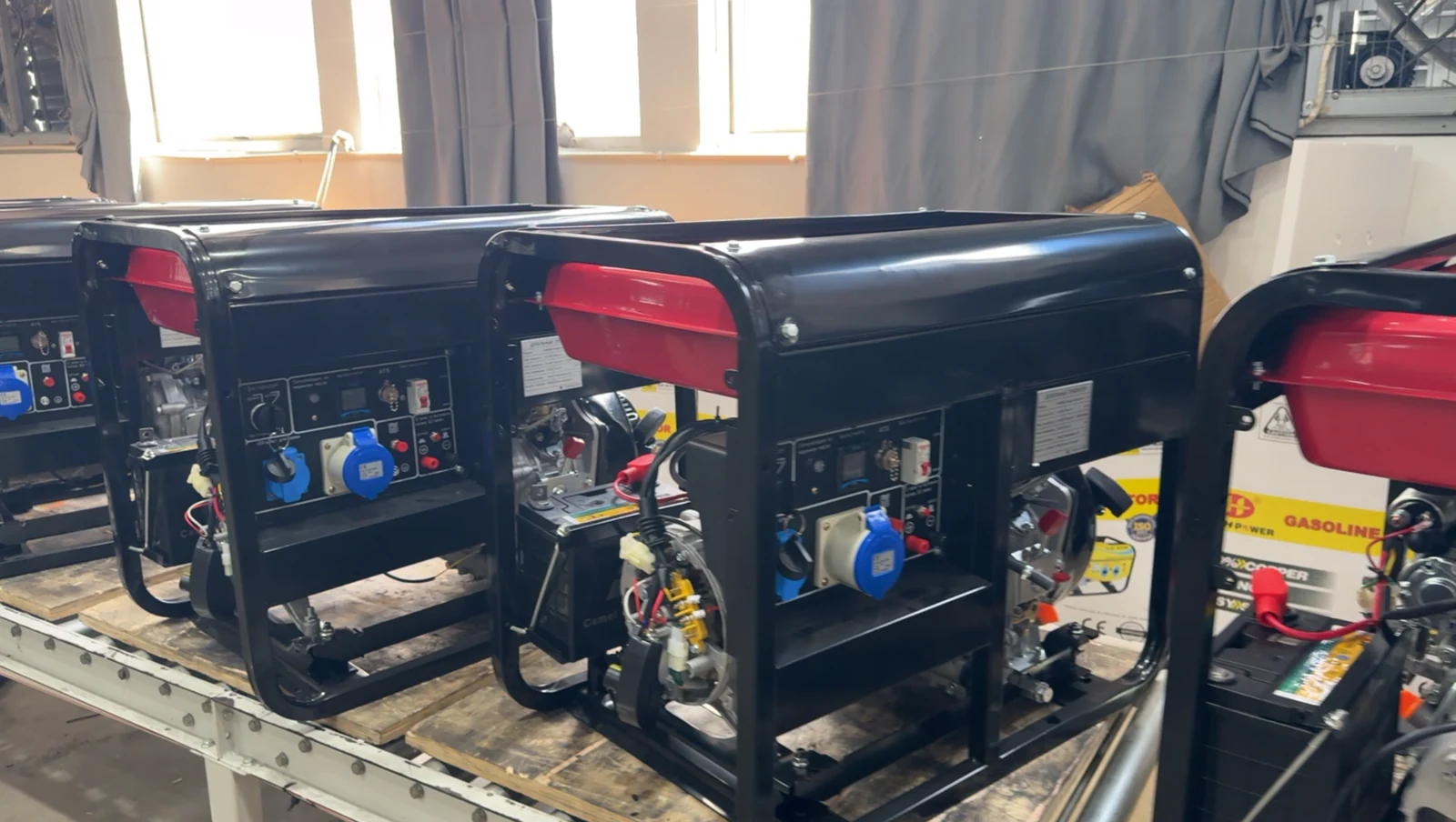 Open-frame generator units positioned in an assembly work area