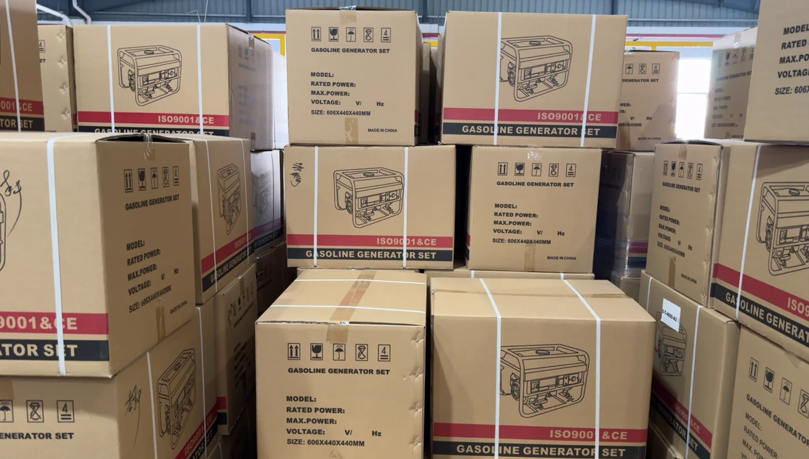Strapped cartons for gasoline generator sets grouped in a staging area